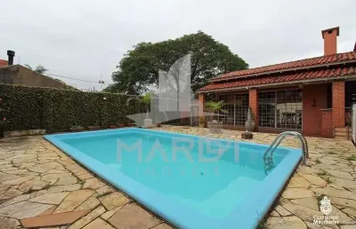 Casa com 3 quartos à venda na avenida guarujá, 70, guarujá, porto alegre por r$ 599.000