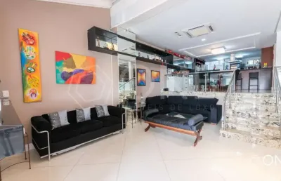 Casa em condomínio fechado com 4 quartos à venda na rua professor doutor milton guerreiro, 210, santa tereza, porto alegre por r$ 1.950.000