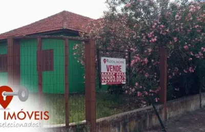 Casa de esquina no centro de tramandaí. aceita permuta