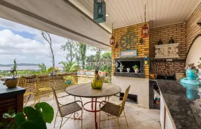 Casa em condomínio fechado com 5 quartos à venda na rua doutor arnaldo da silva ferreira, 450, jardim isabel, porto alegre por r$ 1.500.000