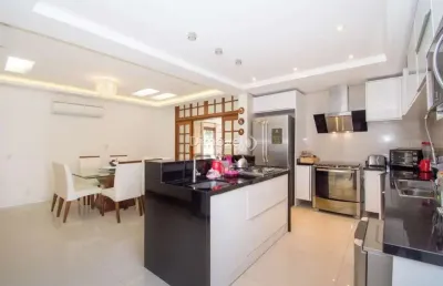 Casa com 4 quartos à venda na avenida pereira passos, 375, vila assunção, porto alegre por r$ 1.490.000