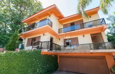 Casa com 4 quartos à venda na rua almirante delamare, 135, tristeza, porto alegre por r$ 1.908.000