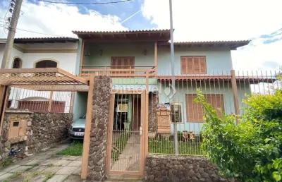 Casa com 4 quartos à venda na rua mário assumpção, 15, guarujá, porto alegre por r$ 750.000