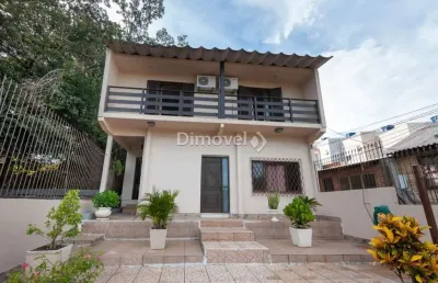 Casa com 4 quartos à venda na avenida belém velho, 2335, vila nova, porto alegre por r$ 695.000
