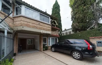 Casa com 3 quartos à venda na avenida copacabana, 358, tristeza, porto alegre por r$ 1.065.000