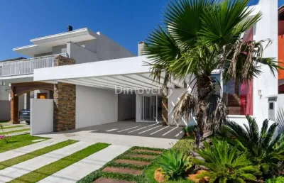 Casa em condomínio fechado com 5 quartos à venda na avenida juca batista, 8000, belém novo, porto alegre por r$ 2.250.000