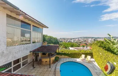 Casa com 5 quartos à venda na rua coroados, 526, vila assunção, porto alegre por r$ 1.280.000