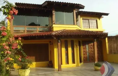Casa com 4 quartos à venda na rua marquês do maricá, 550, vila nova, porto alegre por r$ 856.000