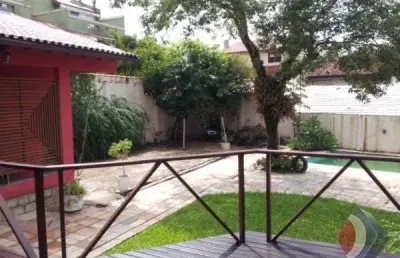 Casa com 4 quartos à venda na avenida flamengo, 413, ipanema, porto alegre por r$ 998.000