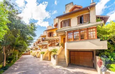 Casa em condomínio fechado com 4 quartos à venda na rua padre joão batista reus, 438, tristeza, porto alegre por r$ 1.490.000