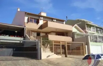 Casa com 4 quartos à venda na rua general rondon, 1567, tristeza, porto alegre por r$ 1.980.000