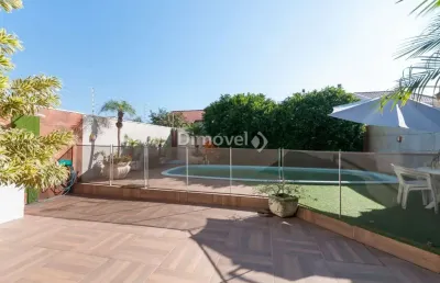 Casa com 4 quartos à venda na rua ancara, 381, guarujá, porto alegre por r$ 900.000