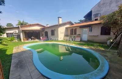 Casa com 3 quartos à venda na avenida copacabana, 130, vila assunção, porto alegre por r$ 2.120.000
