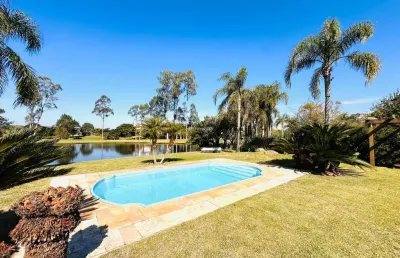 Casa em condomínio fechado com 4 quartos para alugar na avenida juca batista, 8000, belém novo, porto alegre por r$ 15.000
