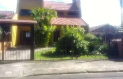 Casa em condomínio fechado com 4 quartos à venda na rua fernando ferrari, 449, piratini, sapucaia do sul por r$ 750.000
