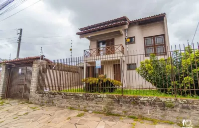 Casa com 4 quartos à venda na rua joão silveira camboim, 57, camboim, sapucaia do sul por r$ 750.000