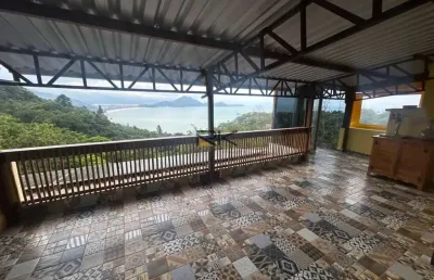 Casa em condominio com 5 dormitórios,4 vagas de garagem,varanda gourmet com churrasqueira e piscina com vista para o mar