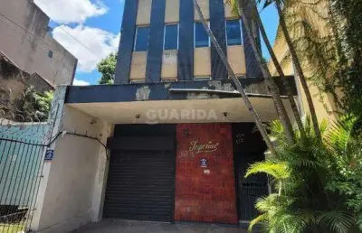 Prédio com 3 pavimentos, loja na parte térrea, e 2 vagas de garagem no bairro santana
