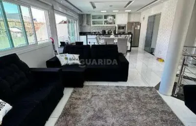 Casa residencial com 3 dormitórios, sendo 1 suíte, e 5 vagas de garagem no bairro jardim leopoldina