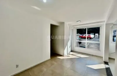 Apartamento térreo com 2 dormitórios e 1 vaga de garagem no bairro vila nova - porto alegre/rs