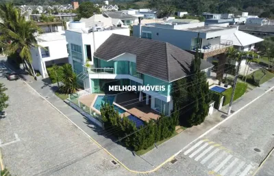 Vivendas do atlântico - casa alto padrão á venda com 4 suítes com vista mar localizada na praia do estaleiro em balneário camboriú.