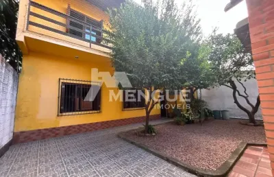 Casa com 4 quartos à venda na avenida teixeira mendes, 328, três figueiras, porto alegre por r$ 850.000