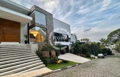 Casa de alto padrão em condomínio fechado a venda em santos, localizada no bairro santa terezinha.