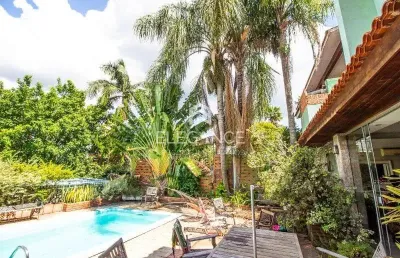 Elegance imóveis vende casa, 380m, 3 dormitórios, 3 suítes, closet, living de 4 ambientes, piscina e 4 vagas de garagem/box. comprar r$ 1.890.000,00.