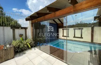 Elegance imóveis vende casa com 325m 4 dormitórios 2 suítes, piscina aquecida salão com churrasqueira e 3 vagas de garagem/box. comprar r$1.890.000,00