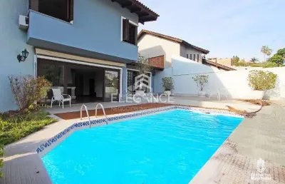 Elegance imóveis vende casa de 430m, 4 dormitórios, 3 suítes, living, piscina churrasqueira, adega e 8 vagas de garagem/box. comprar r$ 2.400.000,00