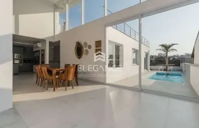 Elegance imóveis vende casa moderna 3 dormitórios suíte pátio com piscina 6 vagas box/garagem chacara das pedras porto alegre. comprar r$ 2.700.000,00