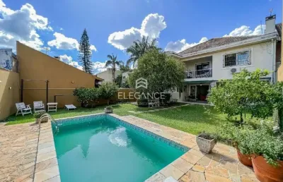 Elegance imóveis vende ótima residência com 362 m2, 4 dormitórios , 3 suítes, piscina,  com 2 vagas garagem. chácara das pedras porto alegre.