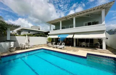 Casa à venda em condomínio jardim acapulco no guarujá | omega imóveis