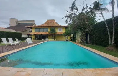Casa à venda no condomínio jardim acapulco no guarujá | omega imóveis