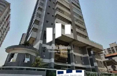 Apartamento em praia grande com 3 dormitórios, 2 vagas de garagem e sacada.