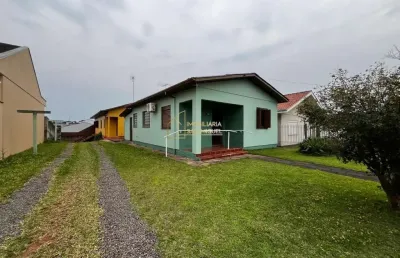 Vende-se terreno com duas casas próximo ao centro de dois irmãos