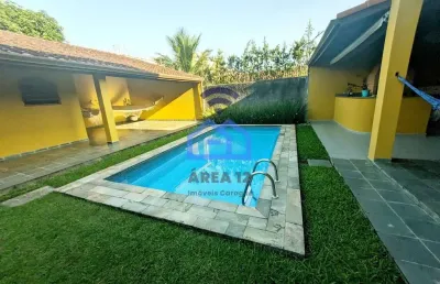 Sobrado amplo com piscina, jardim e churrasqueira à venda no bairro jardim aruan em caraguatatuba,