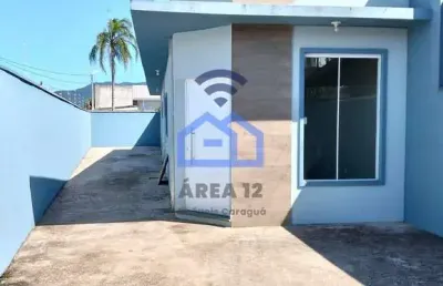 Casa à venda no bairro do golfinho em caraguatatuba, sp - viva confortavelmente com a sua família!