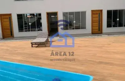 Sobrado novo à venda em condomínio com piscina, a apenas 300m da praia do massaguaçu em caraguatatu