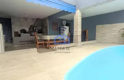 Casa com piscina e área gourmet à venda no bairro do indaiá em caraguatatuba, sp