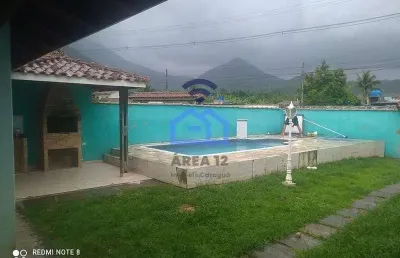 Casa de 3 dormitórios à venda no bairro do massaguaçu em caraguatatuba, sp - com piscina e área gou