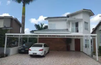 Venda de casa no condomínio arujá country club, em arujá/sp, 380m² com 3 suítes, área gourmet com churrasqueira, cinema e 4 vagas. consulte-nos.
