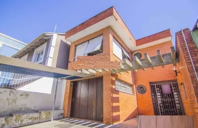 Casa com 4 quartos à venda na rua eudoro berlink, 482, auxiliadora, porto alegre por r$ 1.500.000