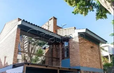 Casa com 3 quartos à venda na avenida américa, 268, auxiliadora, porto alegre por r$ 1.490.000