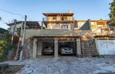 Casa em condomínio fechado com 3 quartos à venda na acesso dos hibiscos, 42, santa tereza, porto alegre por r$ 690.000