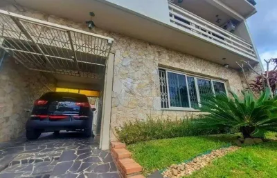 Excelente casa com 3 dormitórios e 3 vagas de garagem