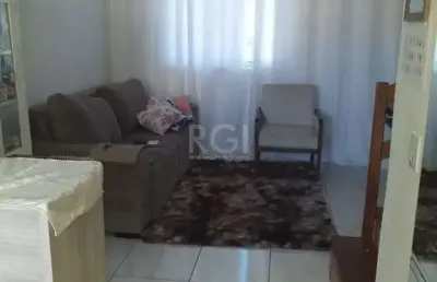 Casa com 2 quartos, banheiro, área de serviço, cozinha, vaga de garagem, no bairro aberta dos morros/rs