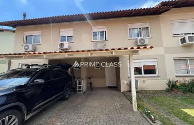 Casa em condomínio fechado com 3 quartos à venda na rua doutor tancredo neves, 160, fátima, canoas por r$ 479.000
