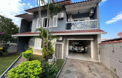 Casa com 4 quartos à venda na rua quinze de novembro, 181, nossa senhora das graças, canoas por r$ 1.380.000