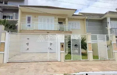 Casa com 4 quartos à venda na rua taurus, 277, loteamento bela vista, canoas por r$ 1.400.000